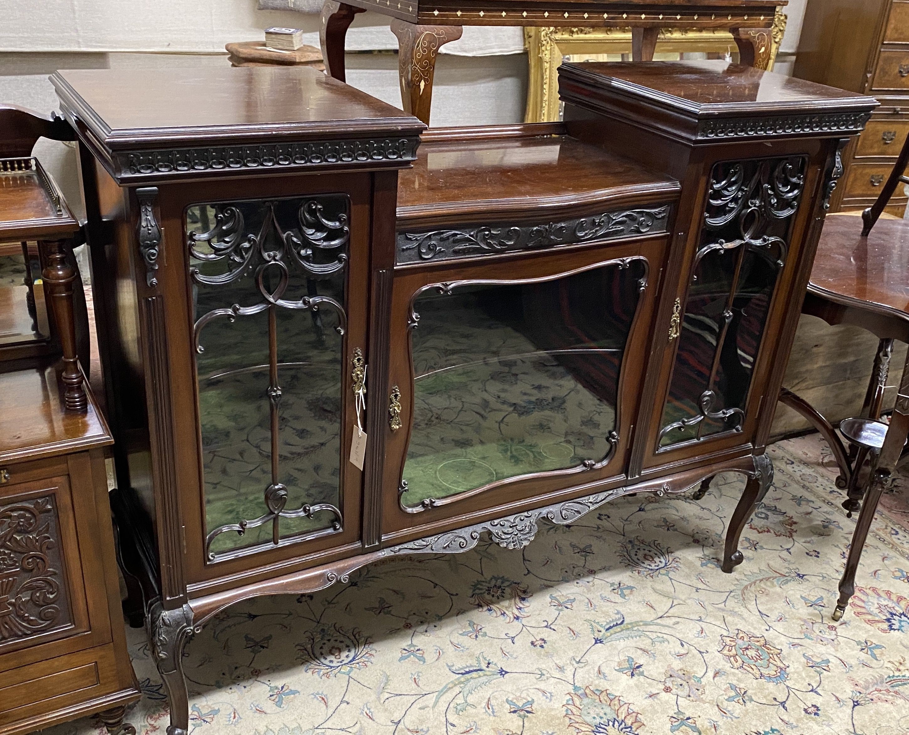 A late Victorian glazed mahogany side cabinet, width 136cm, depth 40cm, height 109cm